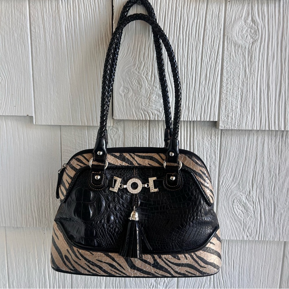 M.C. purse with zebra and croc design.2 pockets and a zipper pocket.